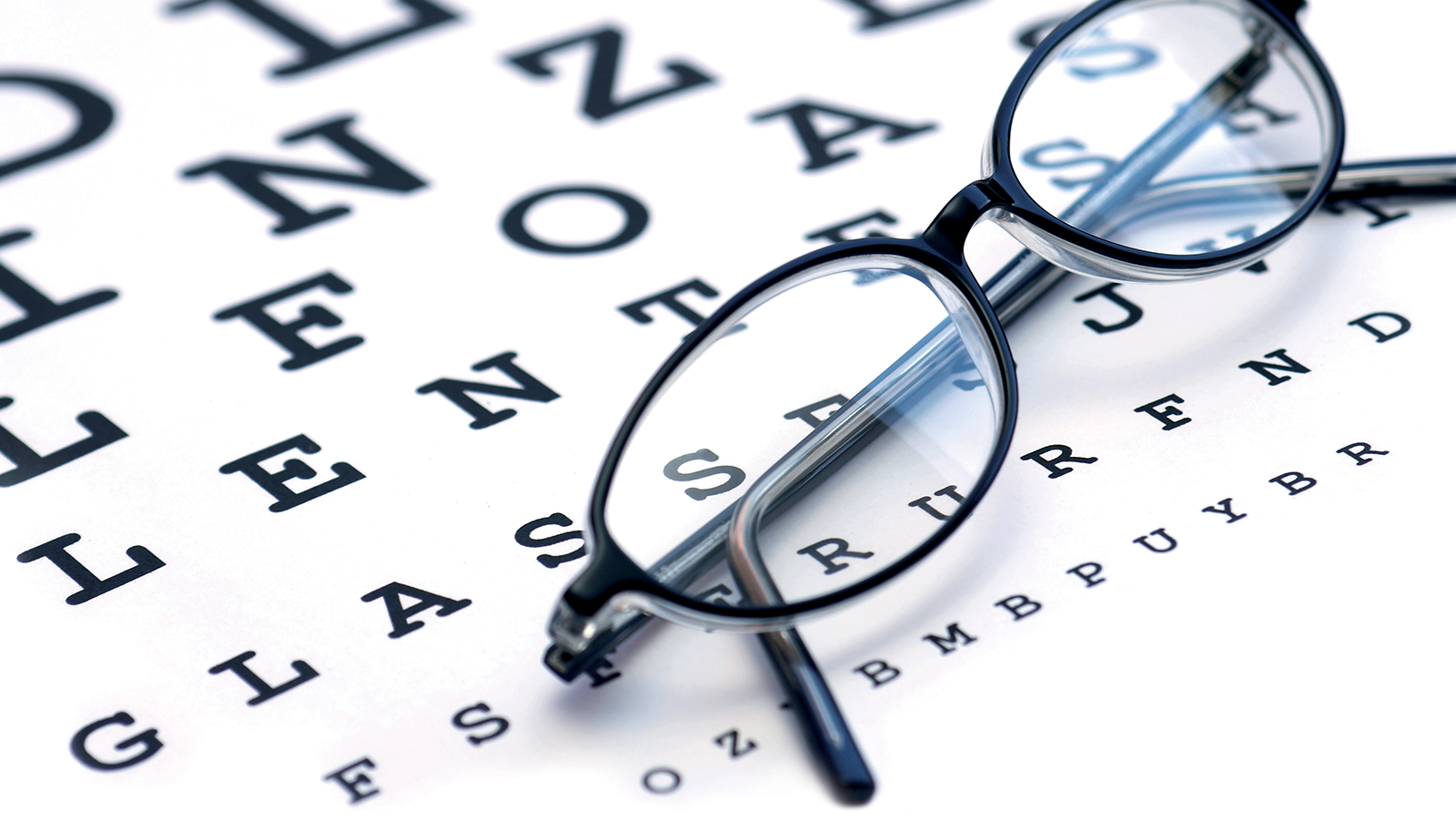 8 Tips to Prevent Eyestrain 11 Eyeglasses on eye chart background.